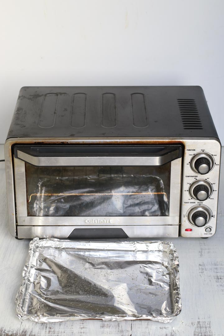 Aluminum lined tray in front of a toaster oven